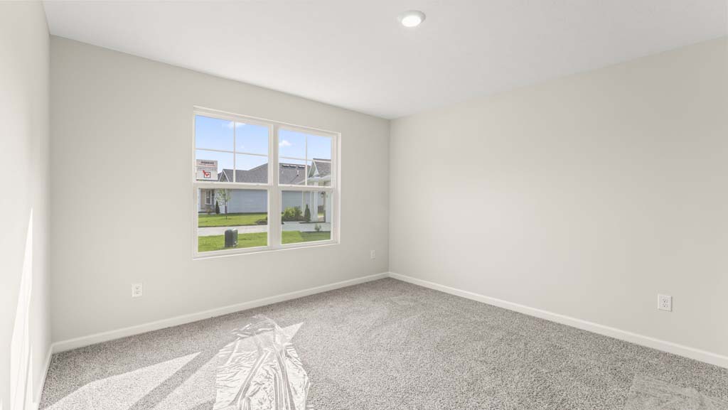 Bedroom with a large window.