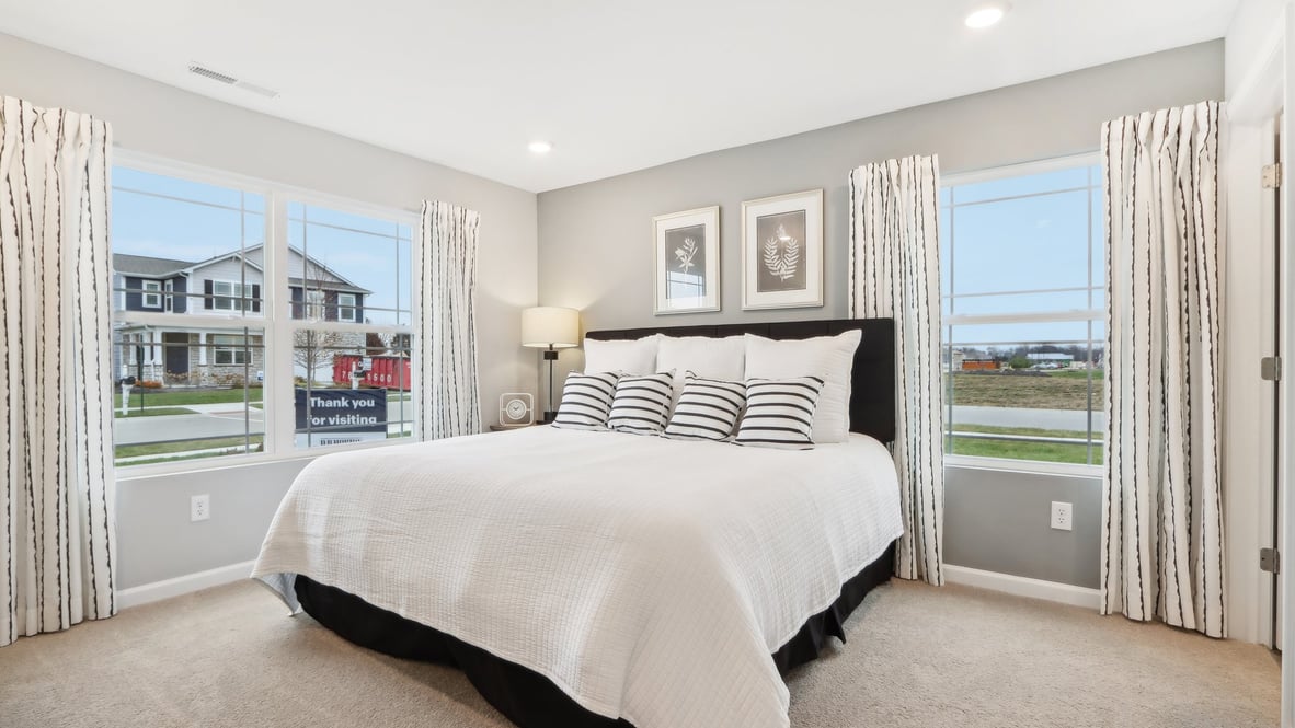 Primary bedroom with modern art.