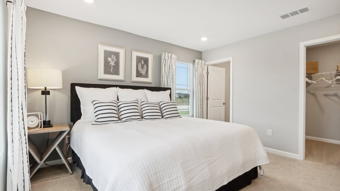 Primary bedroom with modern art.