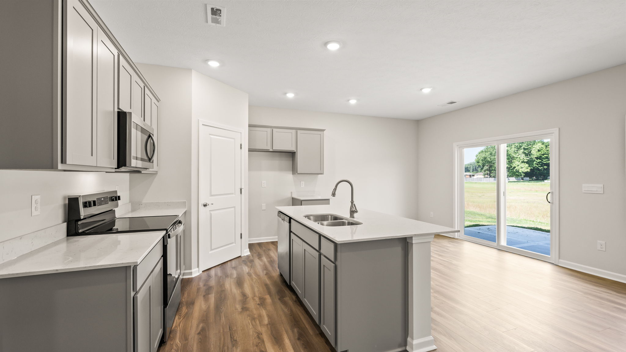 Side view of kitchen with island and dining area