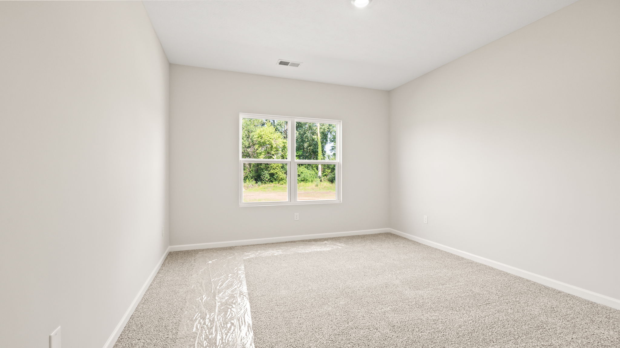 Carpeted primary bedroom