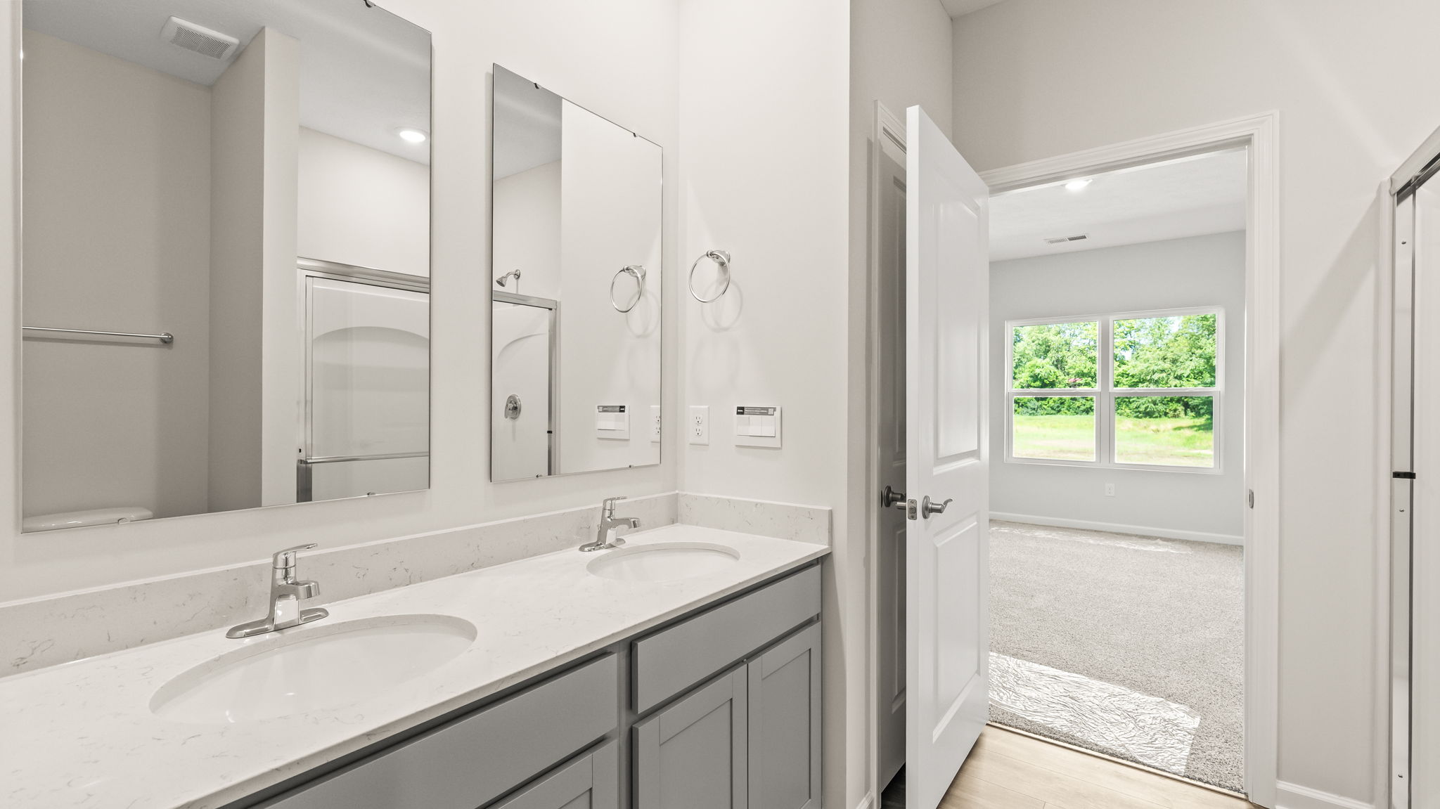 closeup of primary bathroom counter with double bowl vanity