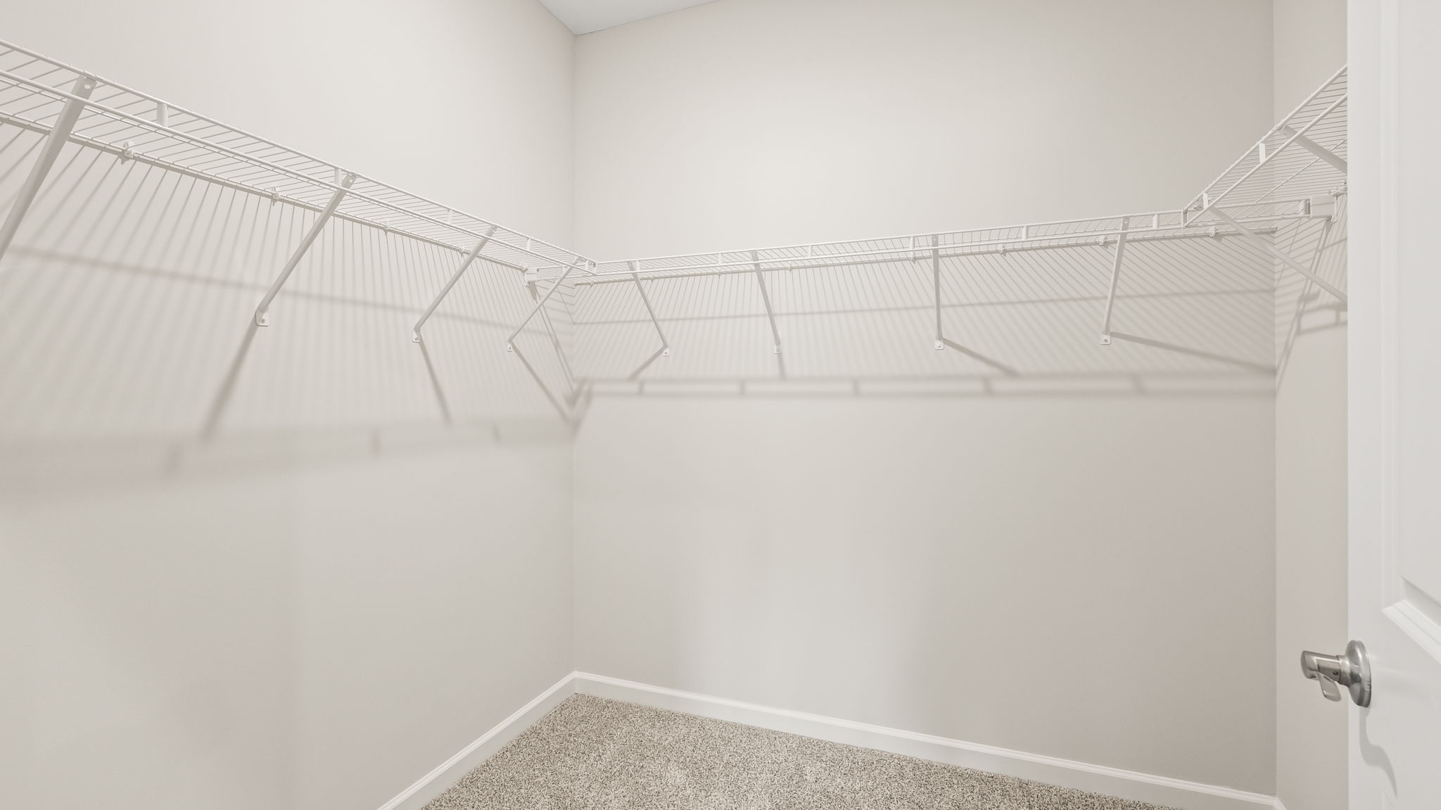 Walk-in closet with wire rack shelving