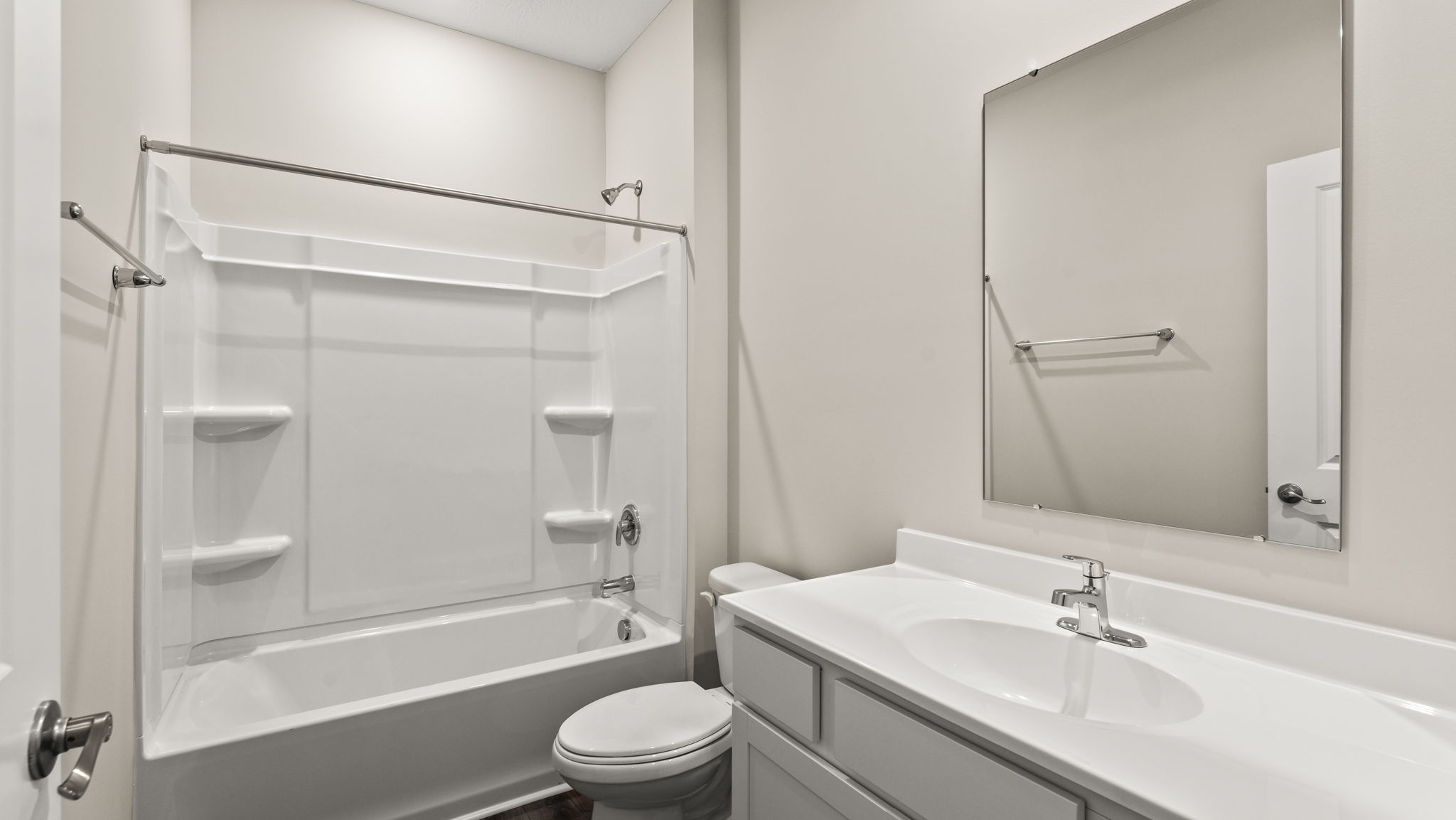 Bathroom with toilet, tub, shower, and sink.