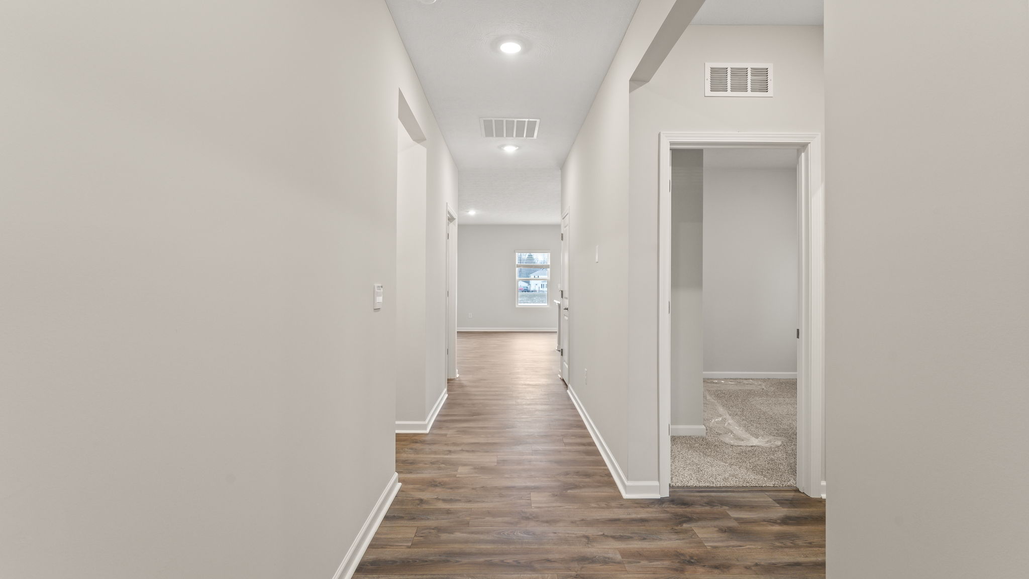 Hallway with closet on the right