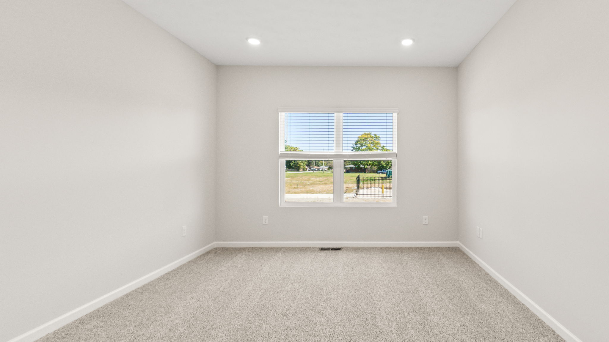 carpeted primary bedroom