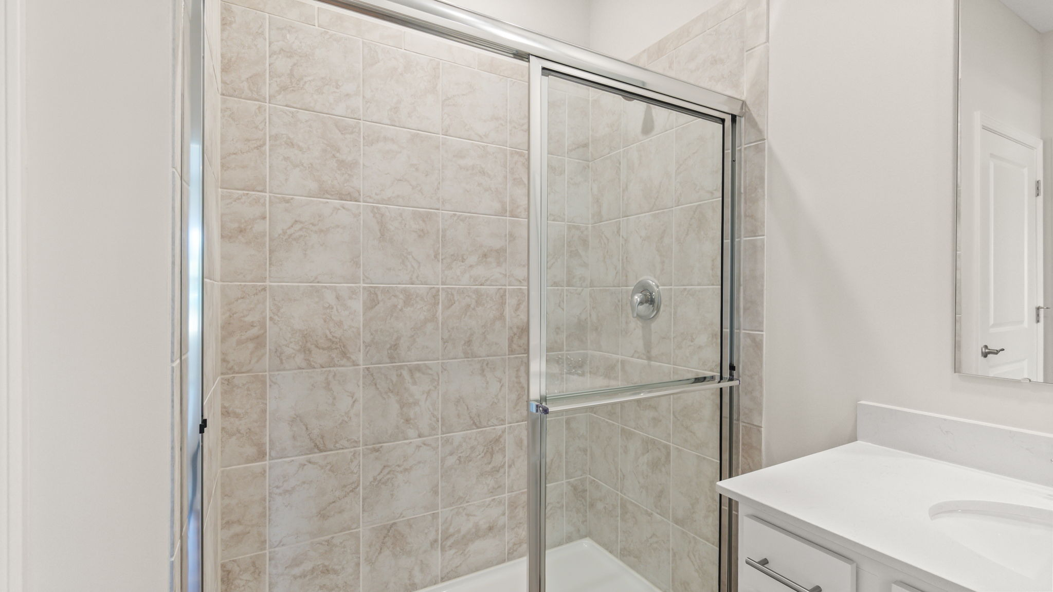 Closeup of bathroom shower with glass door