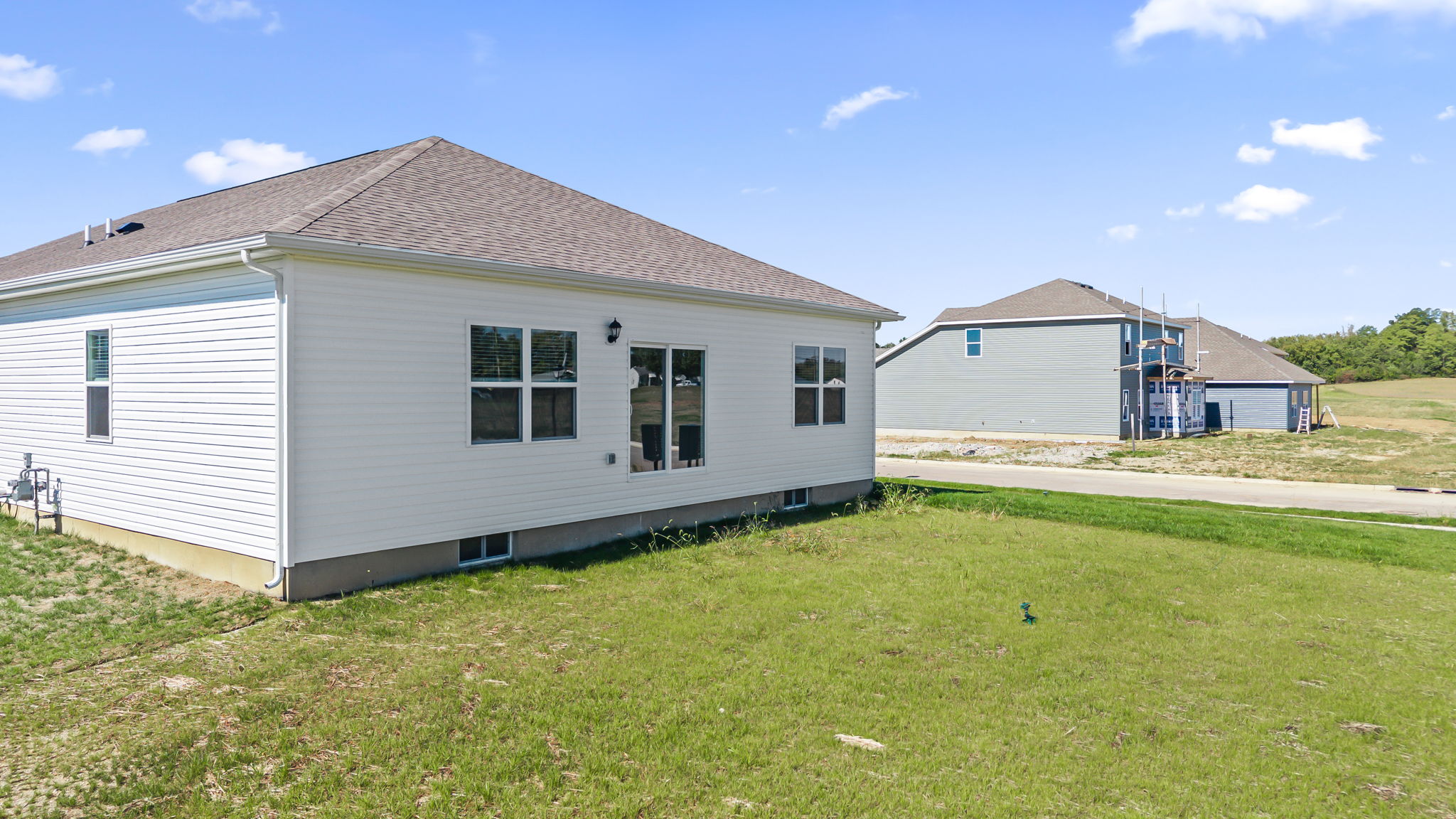 Rear of home with grass