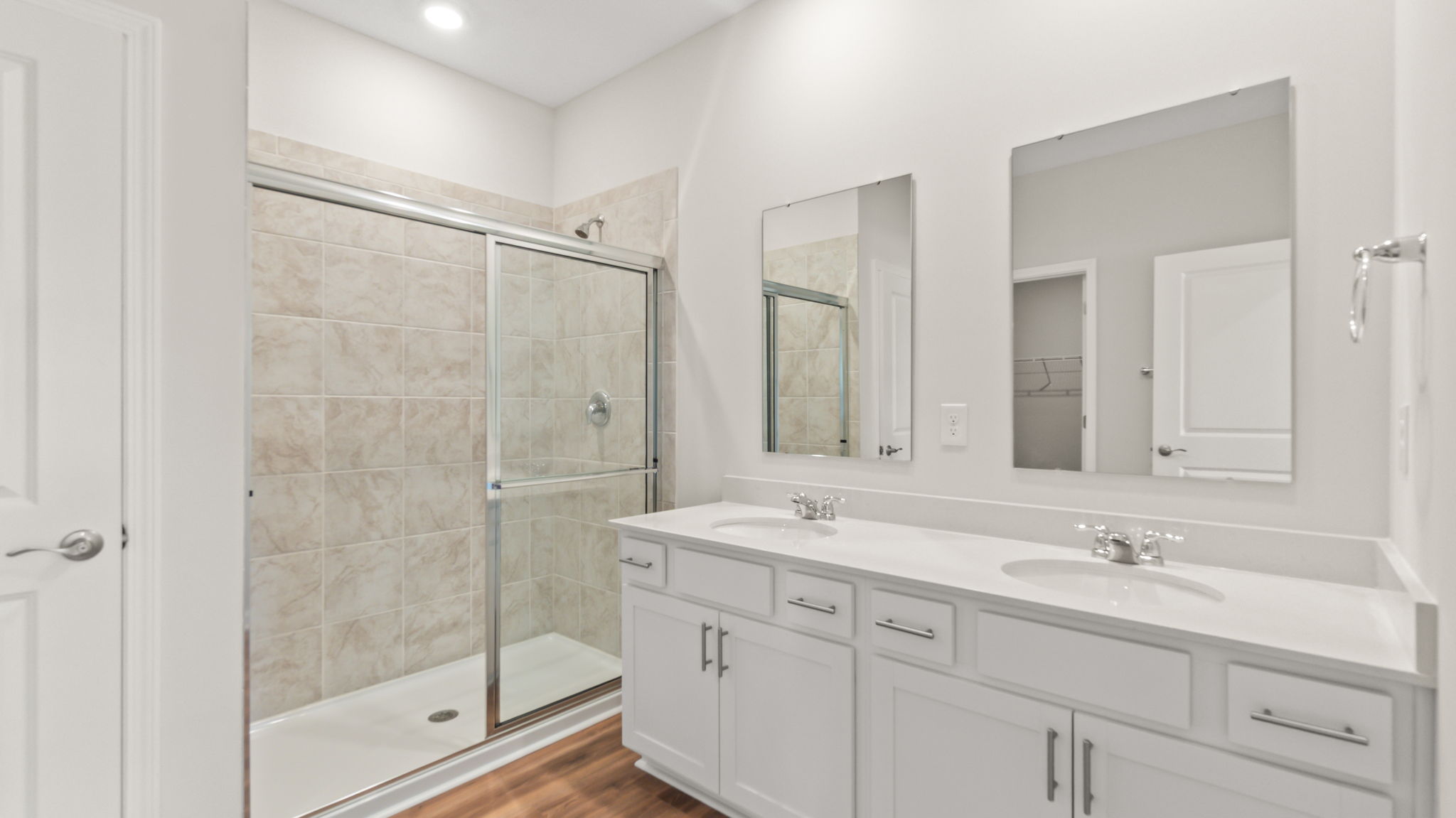 Primary bathroom suite with white countertop
