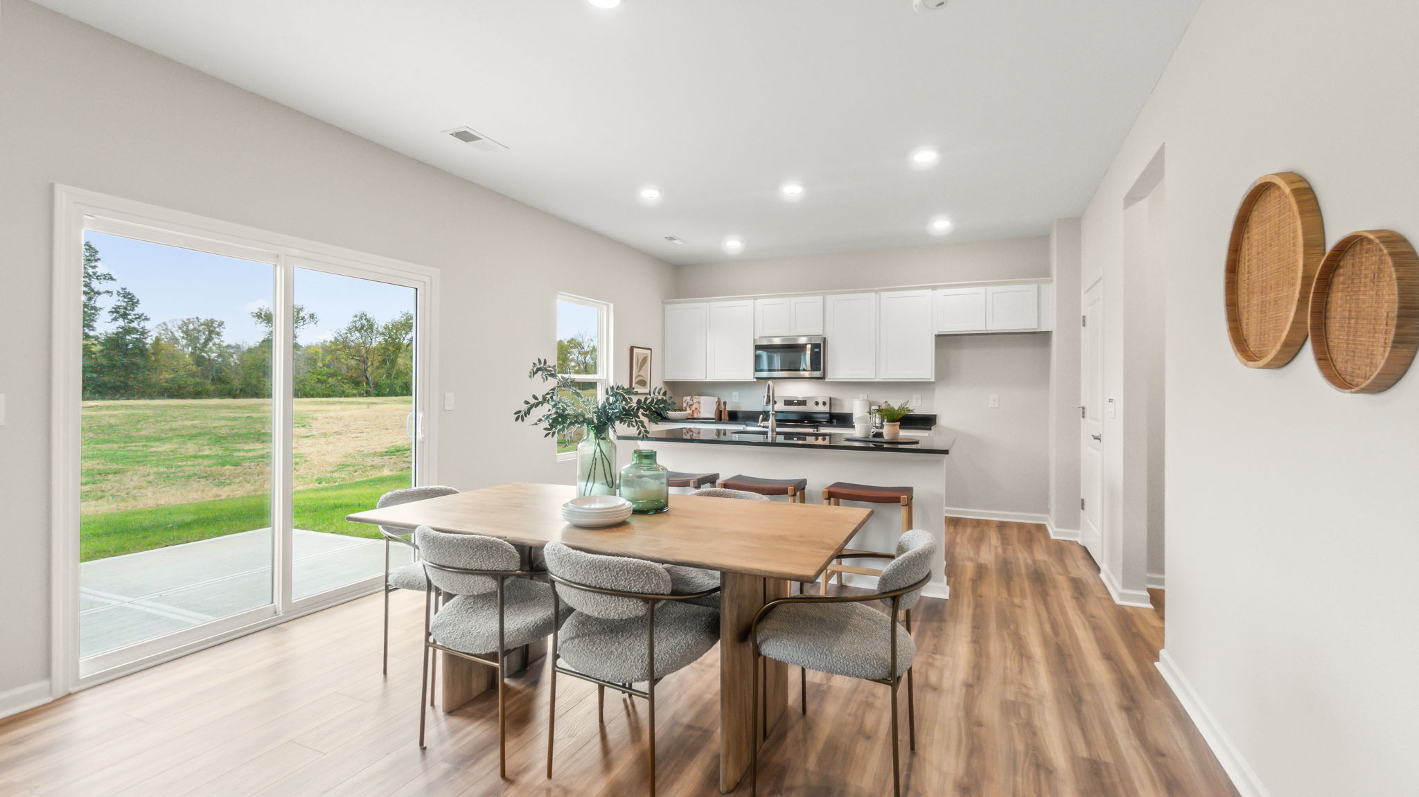 Full dining and kitchen areas in open concept arrangement