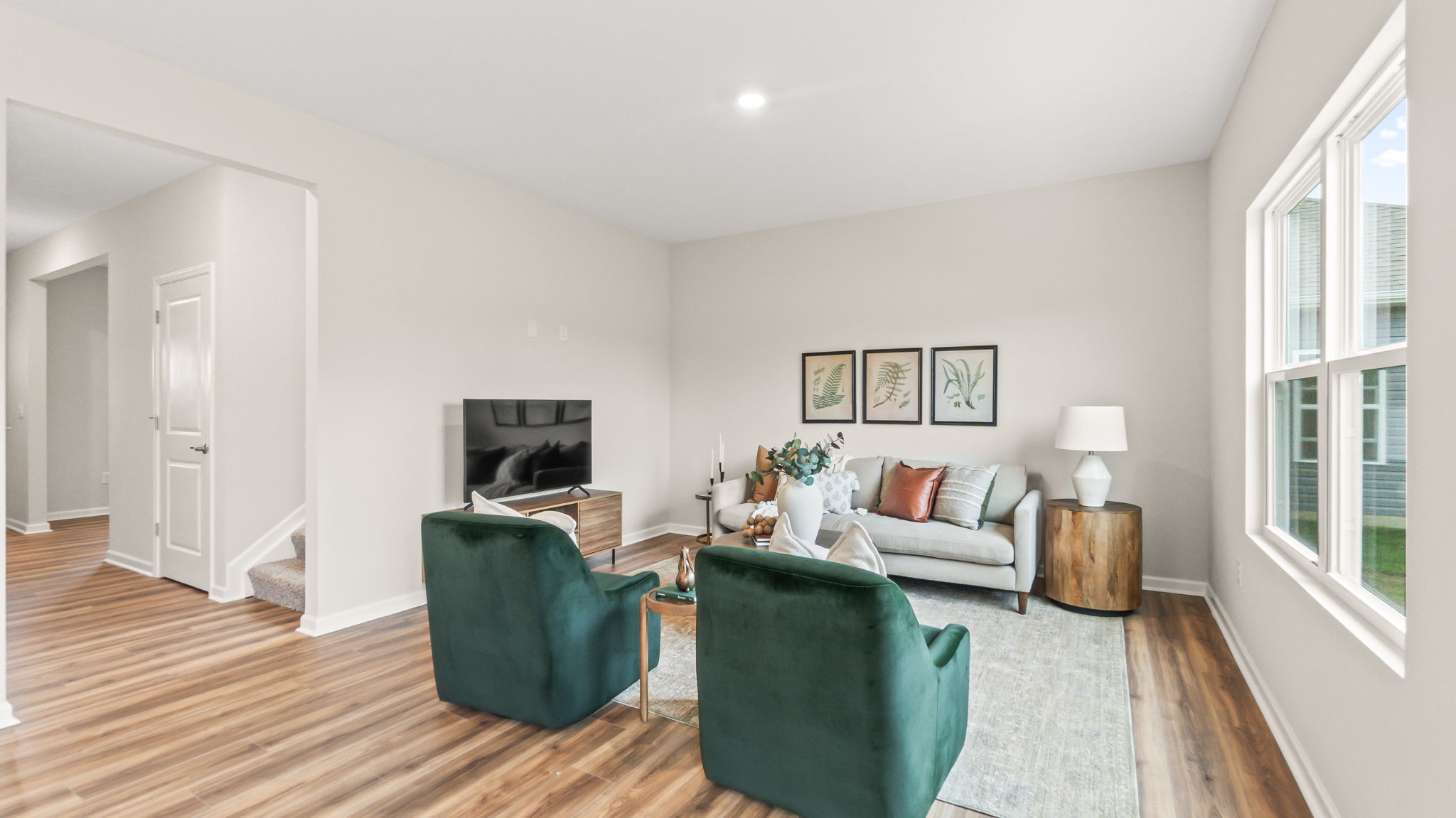 Modern living room with green and brown tones