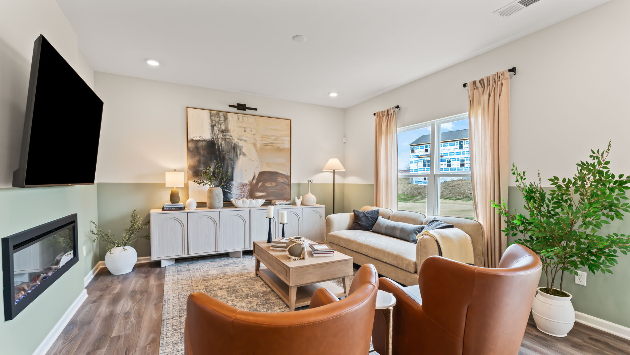 Warm living room with brown and red furniture and two-tone wall