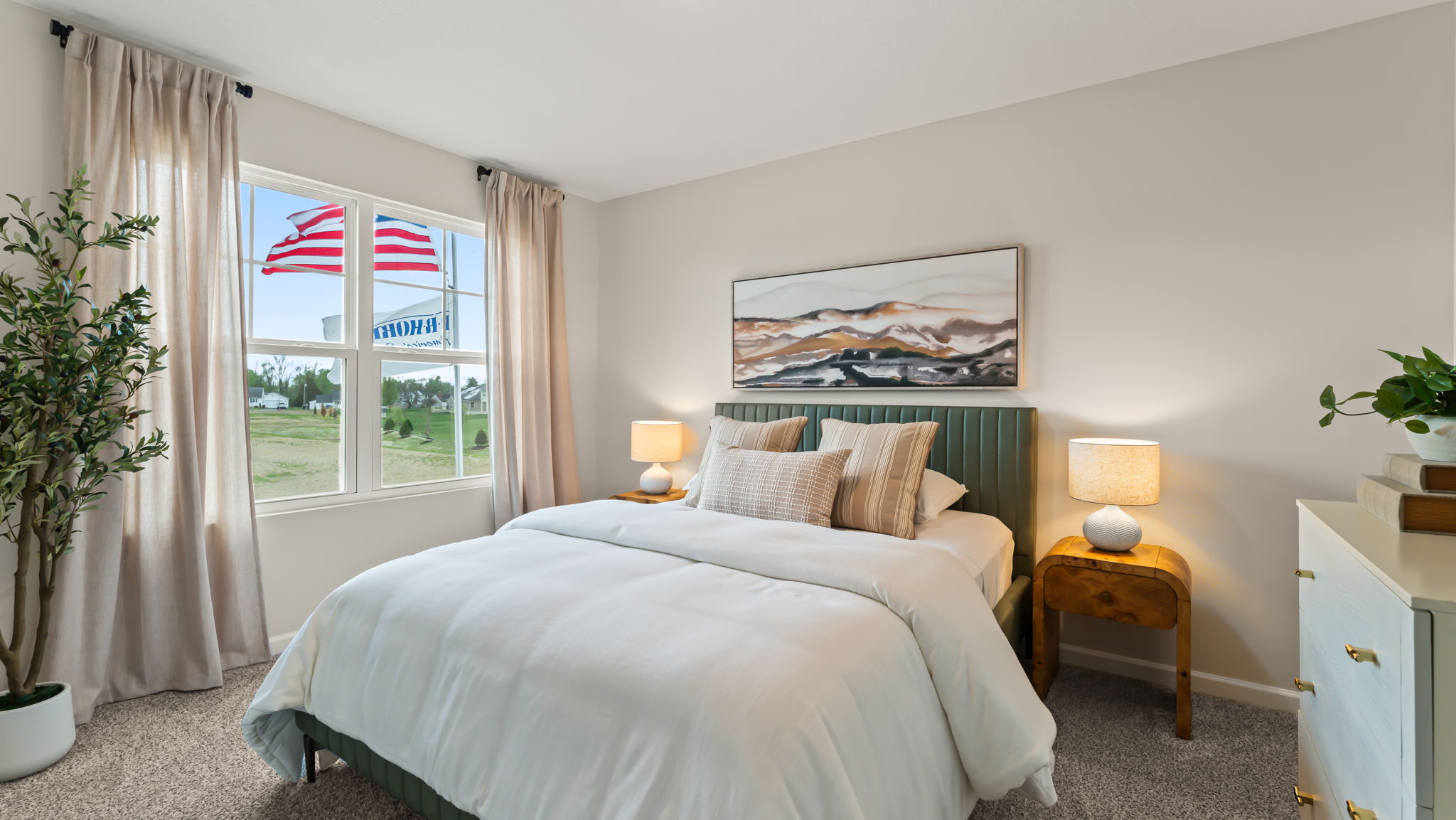 Bedroom with green, brown, and white furniture