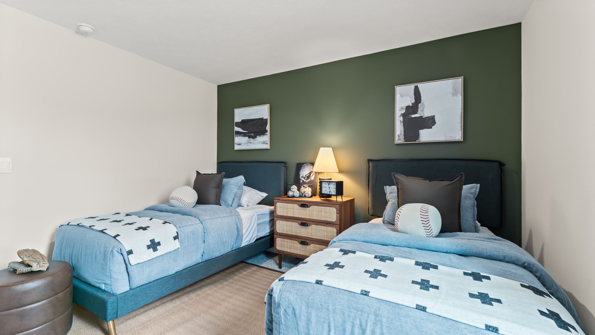 Bedroom containing twin beds and baseball theme
