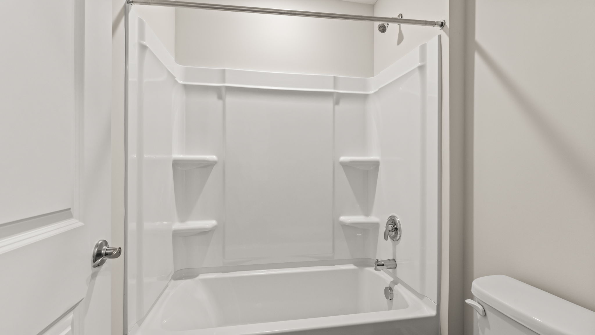 Closeup of tub with tiered shelving