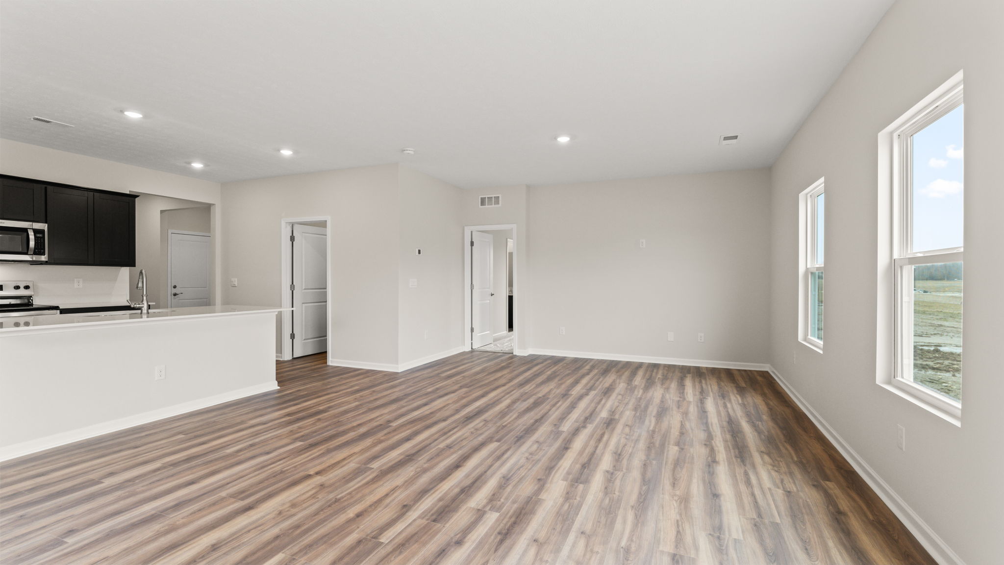 Full great room with two windows on the right