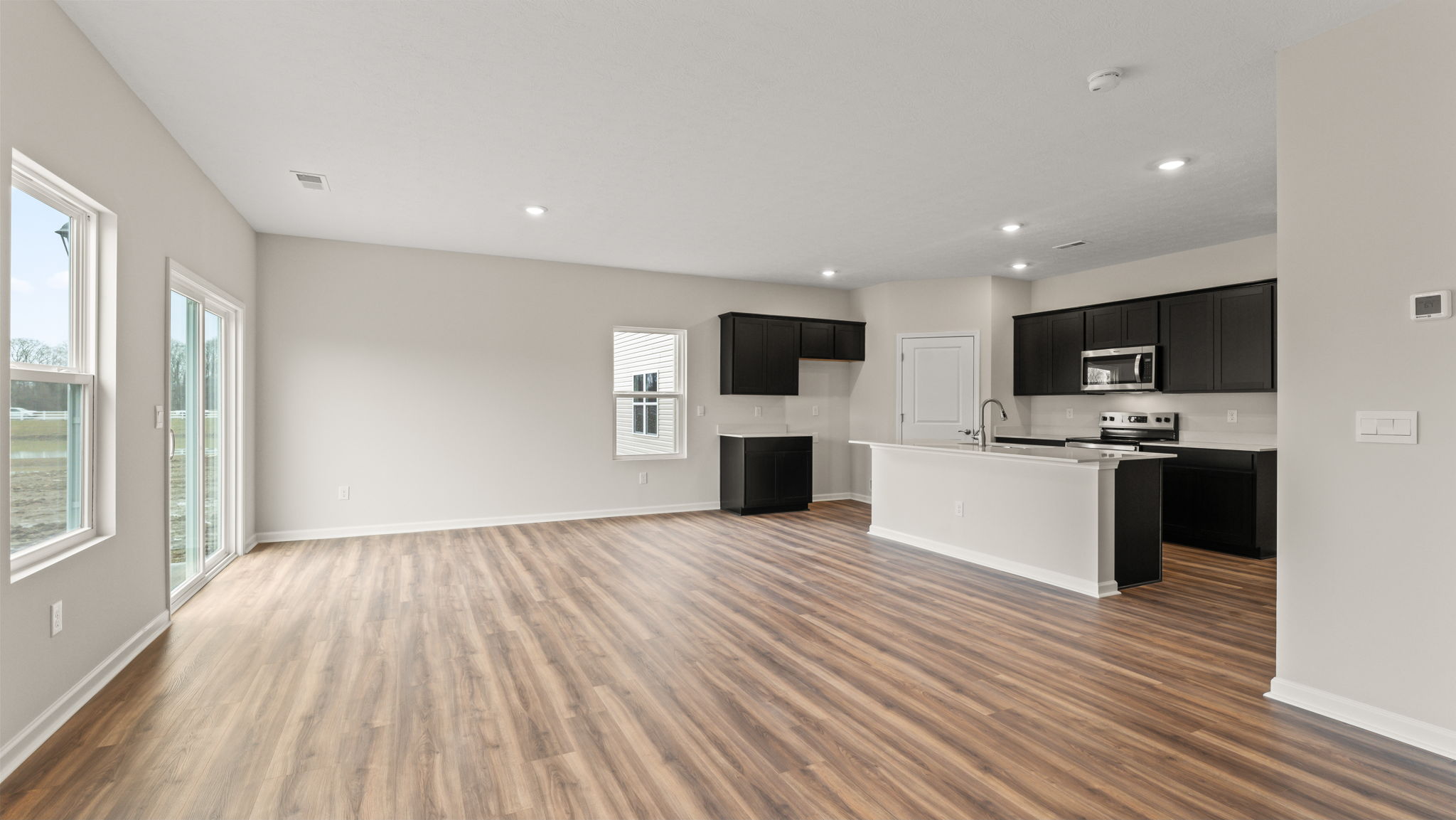 view of the dining and kitchen areas from the living room