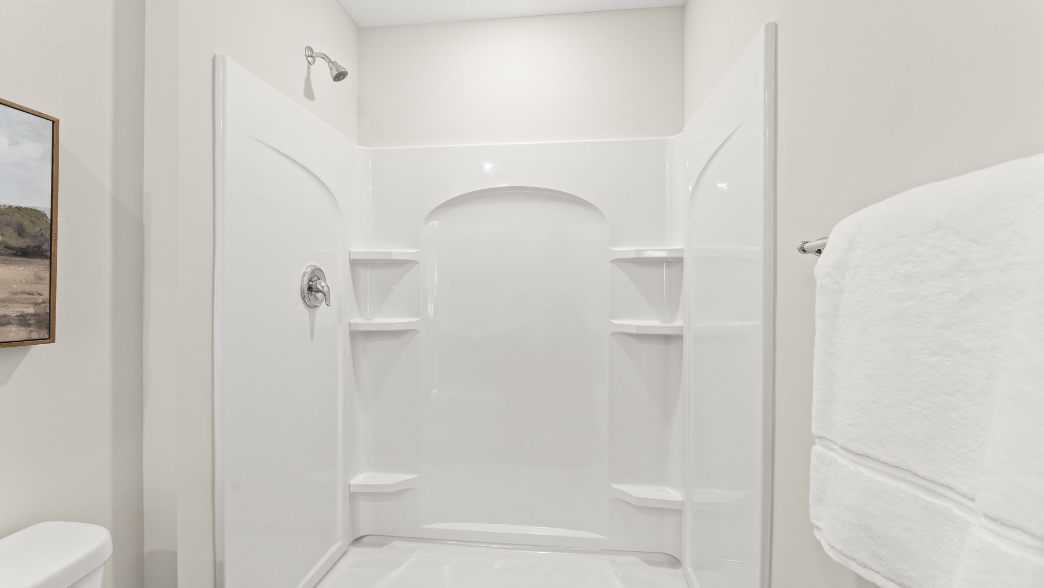 Modern owner’s ensuite bathroom offering spa-level comfort, upgraded bath-shower finishes, and a walk-in closet