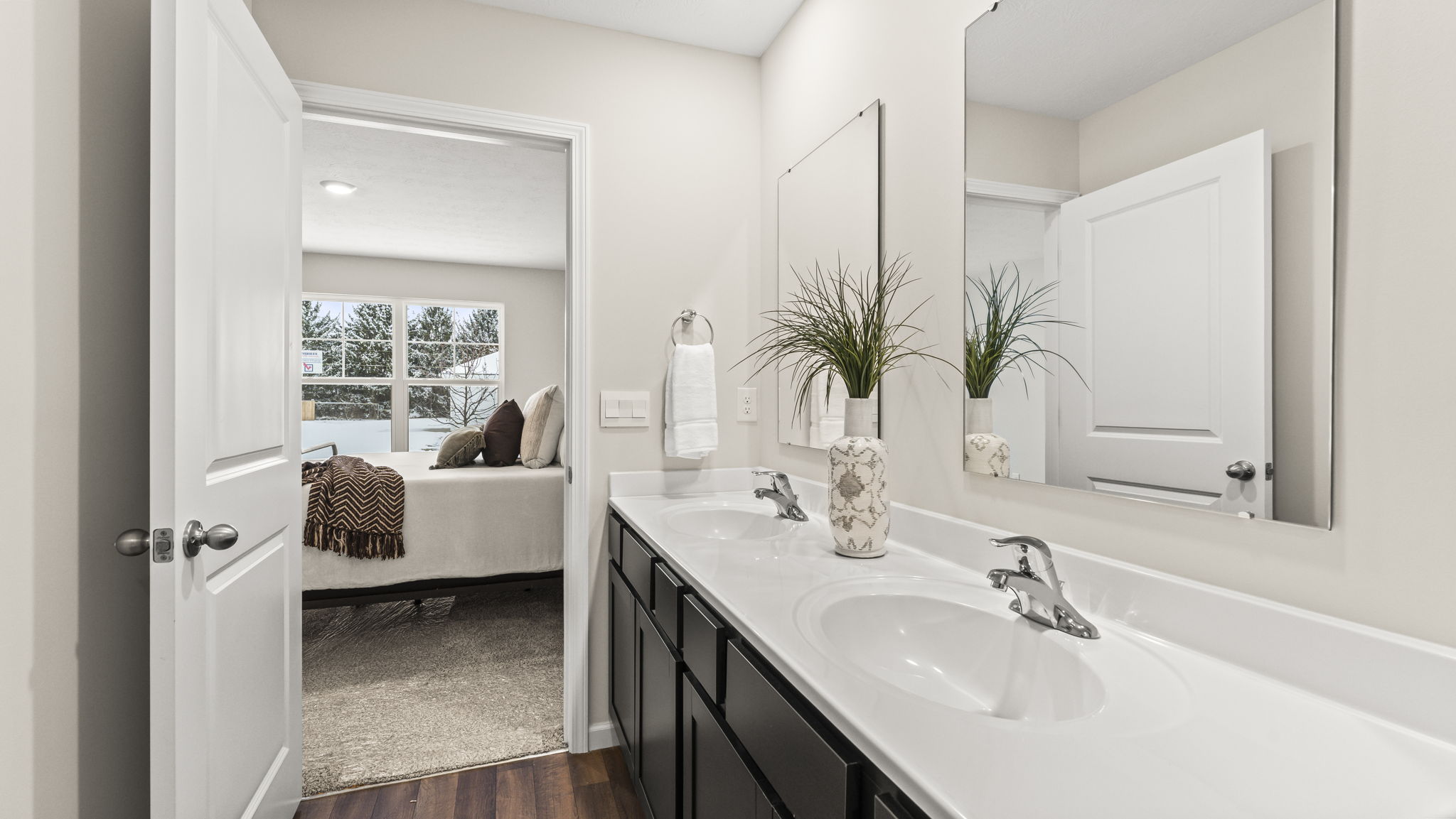 Owner’s ensuite view in our new build home offers function, style with a double vanity, walk-in closet, spa-like ensuite