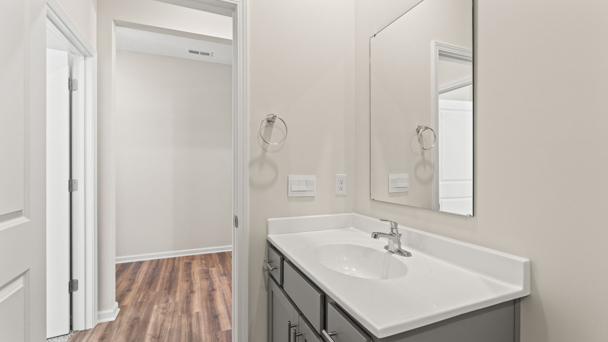 Closeup of bathroom sink and mirror.