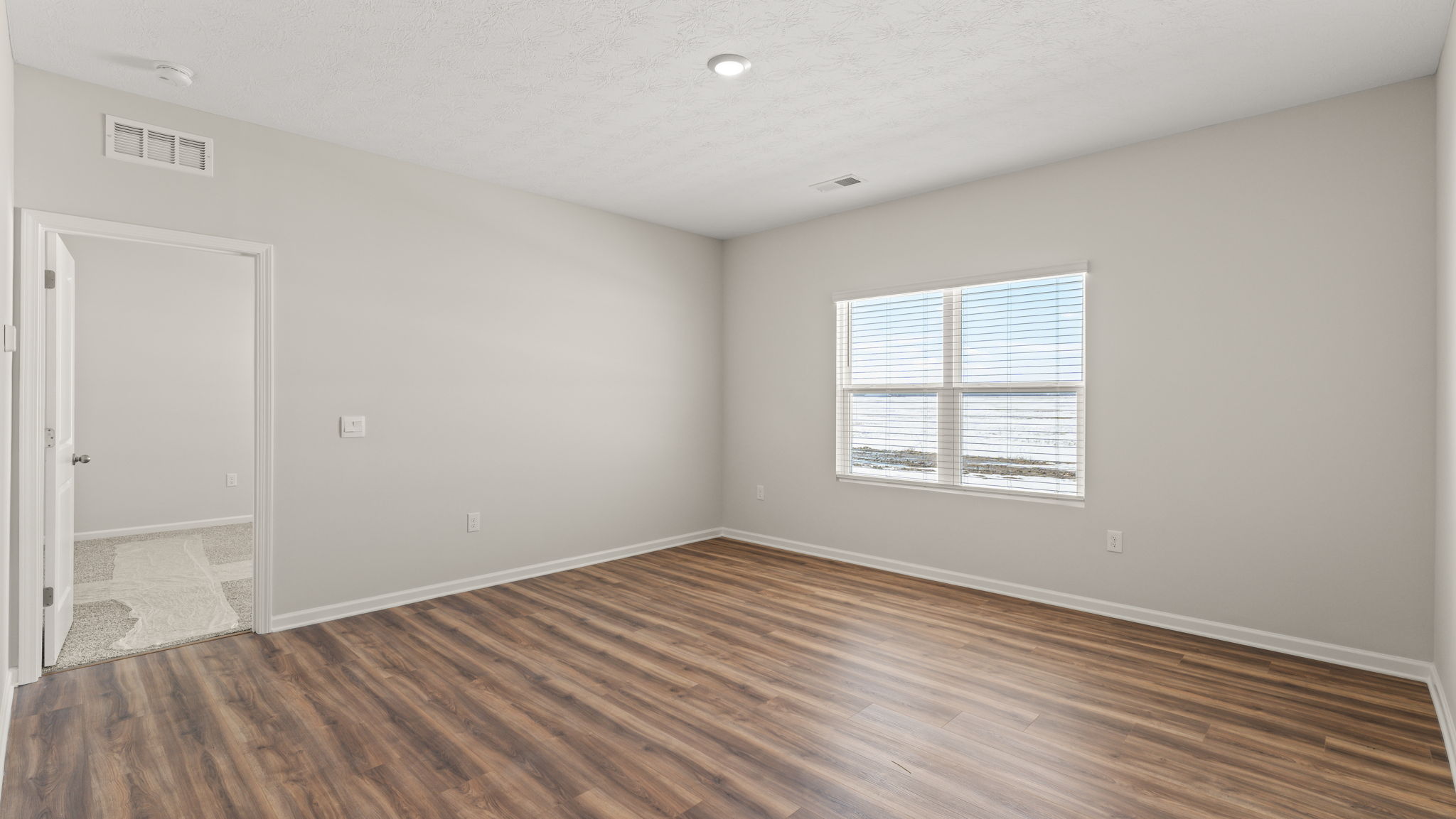 Great room leading to bedroom