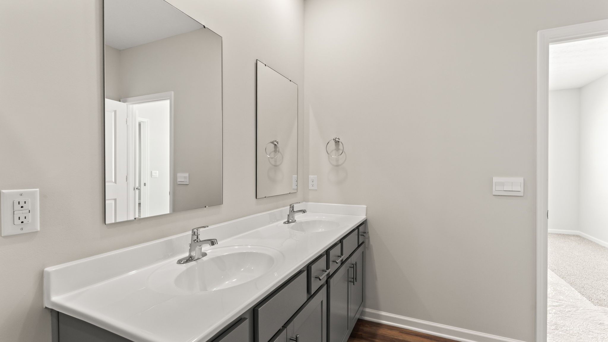 Closeup of dual-sink and mirror vanity