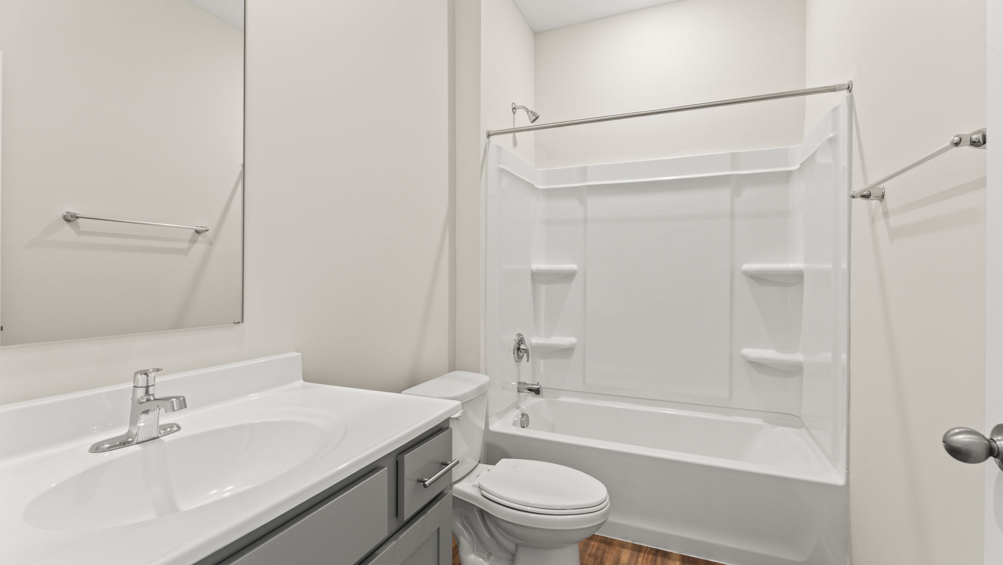 Bathroom with sink, toilet, and tub/shower combo