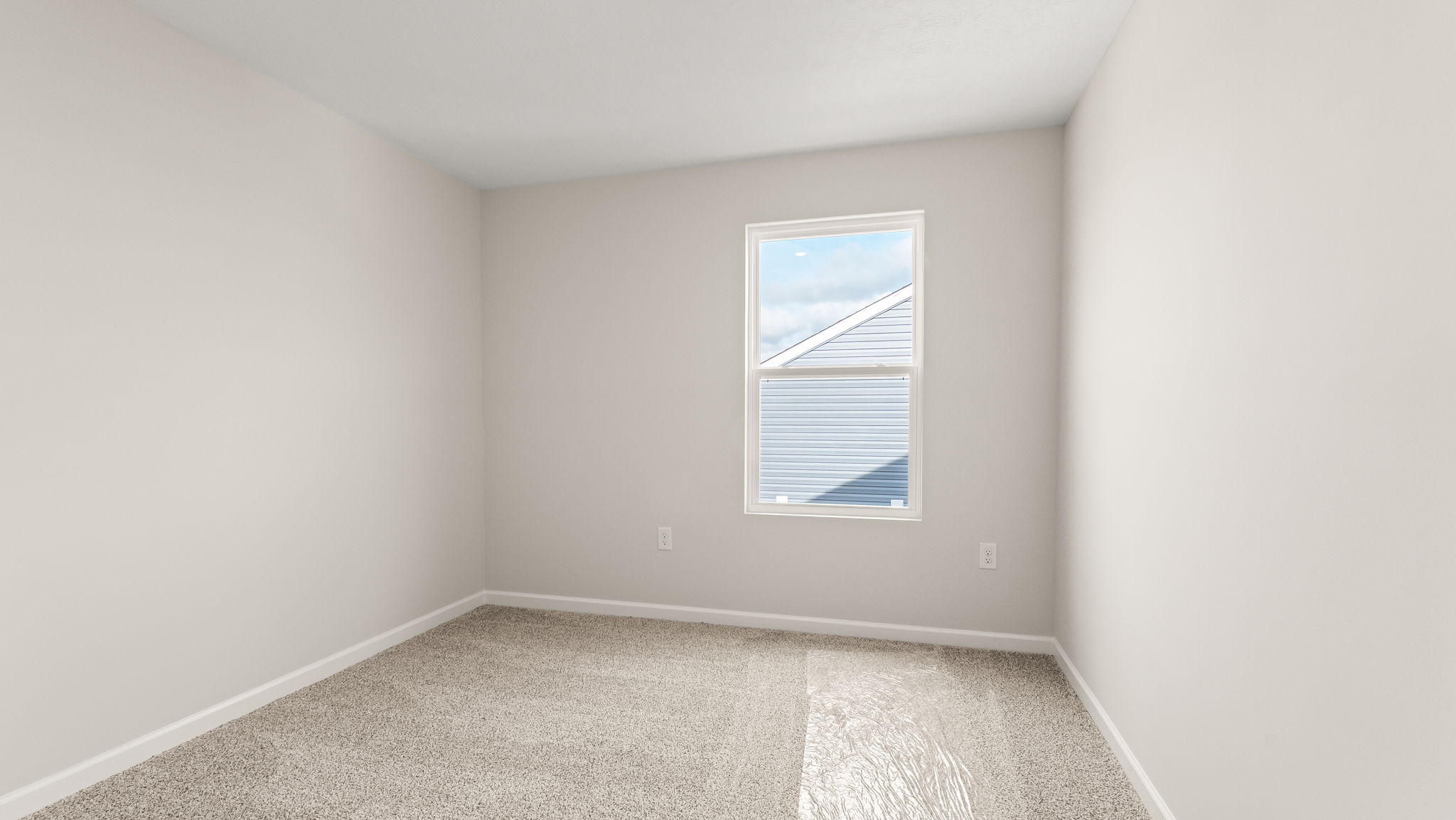 Bedroom 3 with carpet and window to outside.