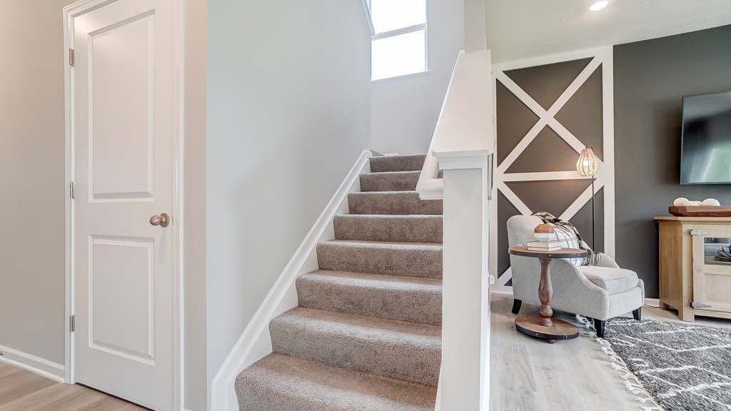 Bottom of stairs leading to upstairs.