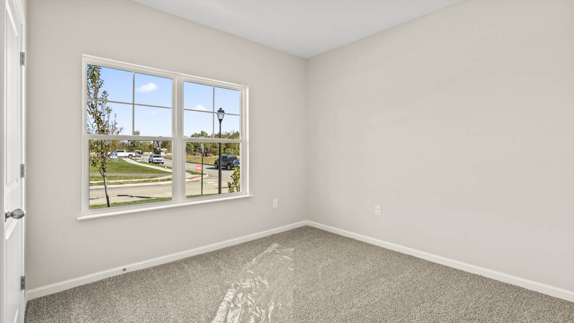 Bedroom with closet on the left and window our