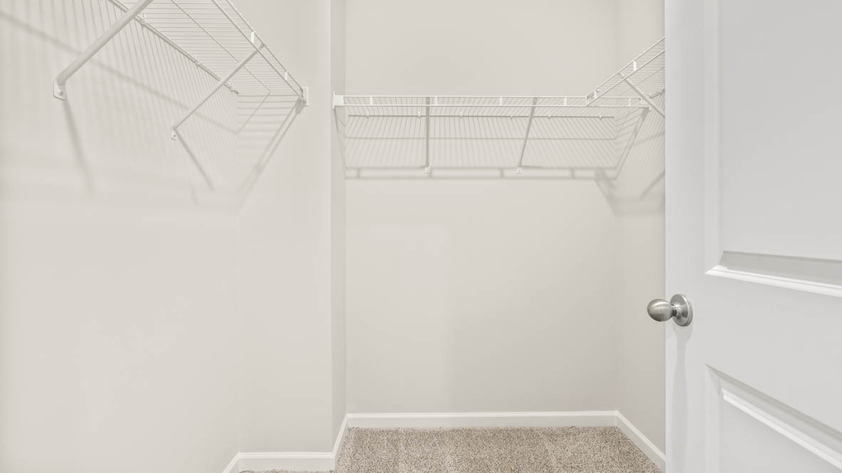 Walk-in closet space with shelves