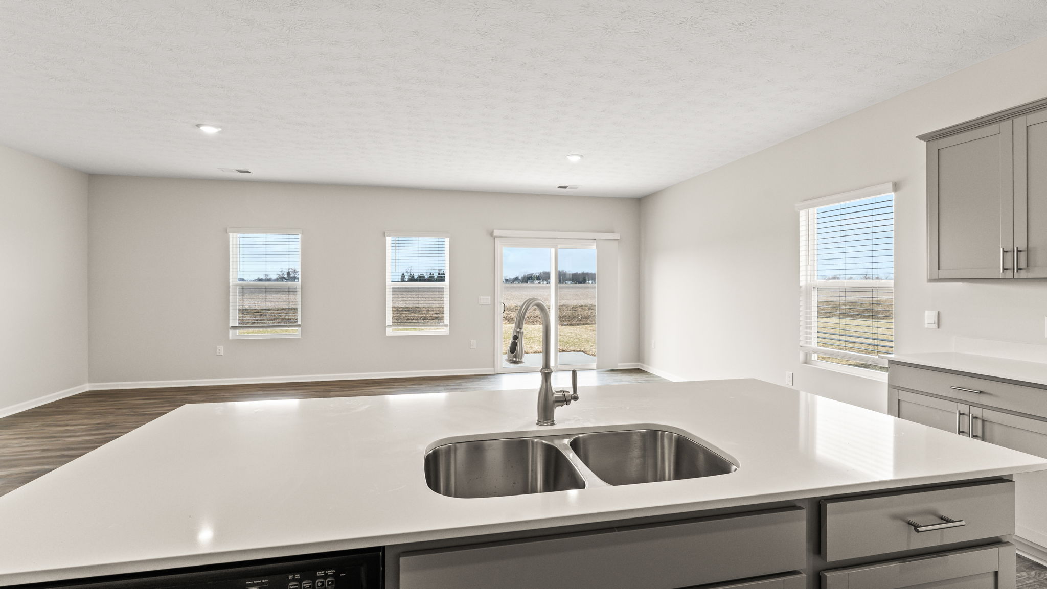 Perspective of the great room from the kitchen island.