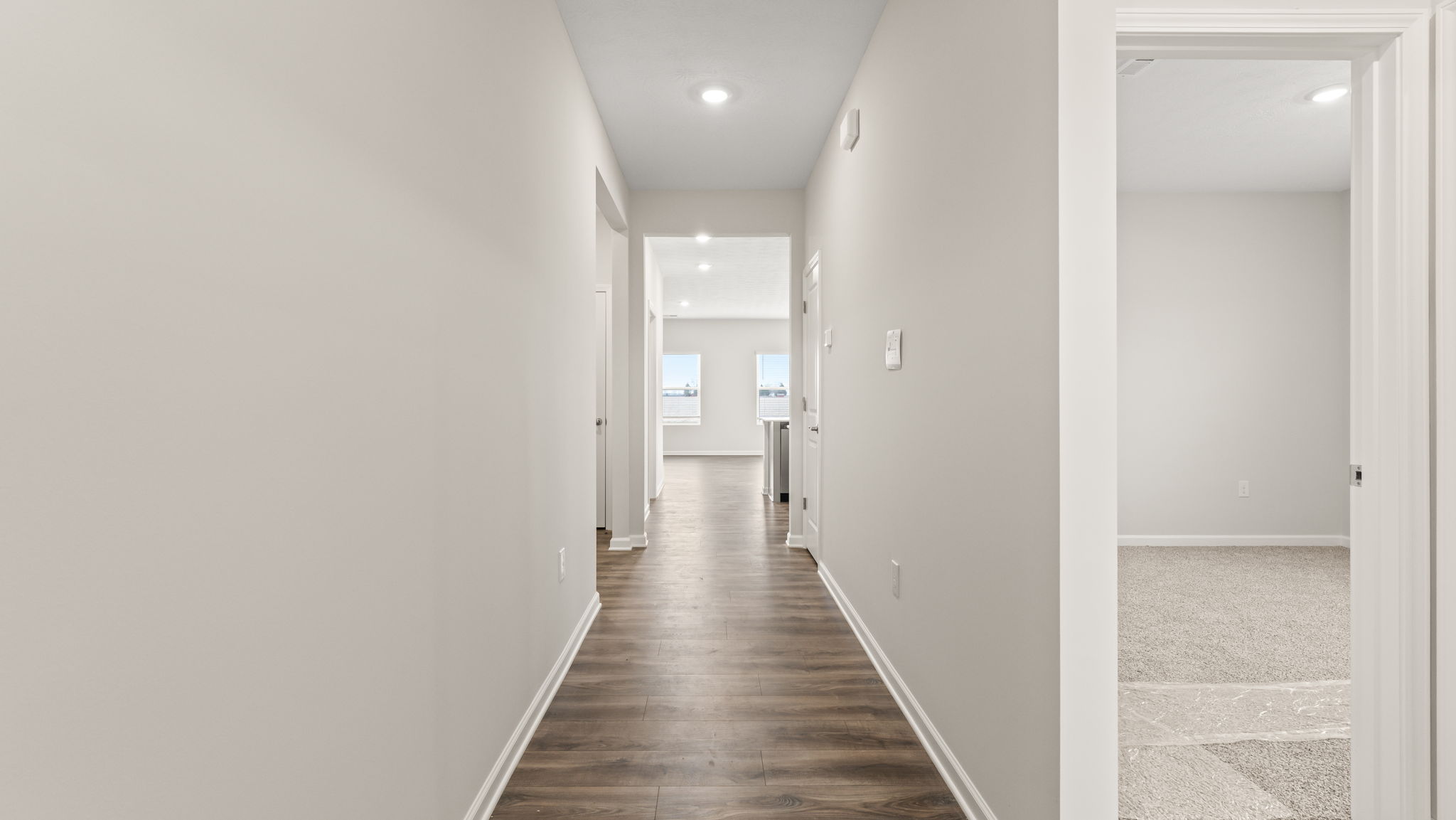 Hallway with perspective of great room.