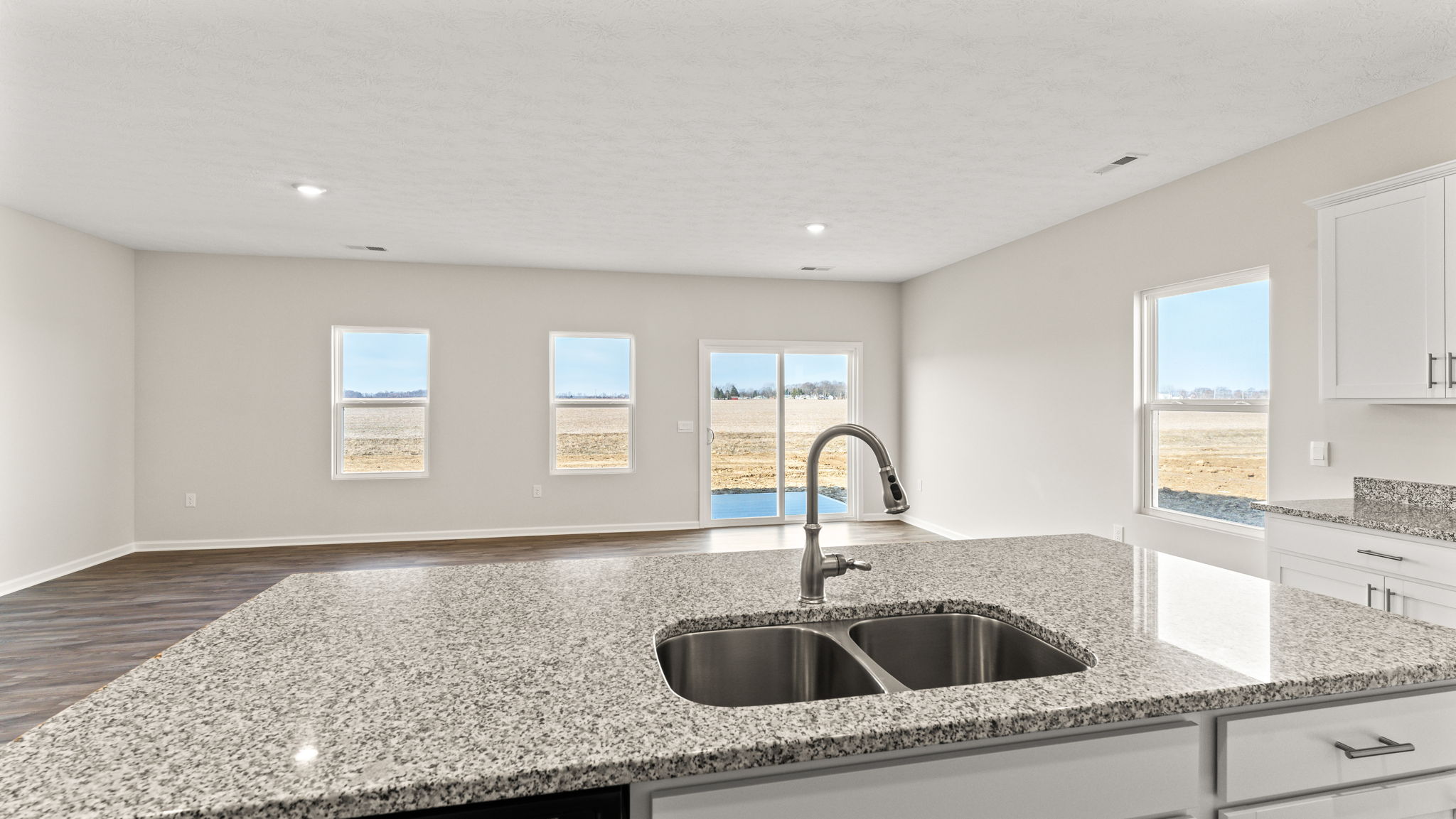 Perspective of the great room from the kitchen sink.