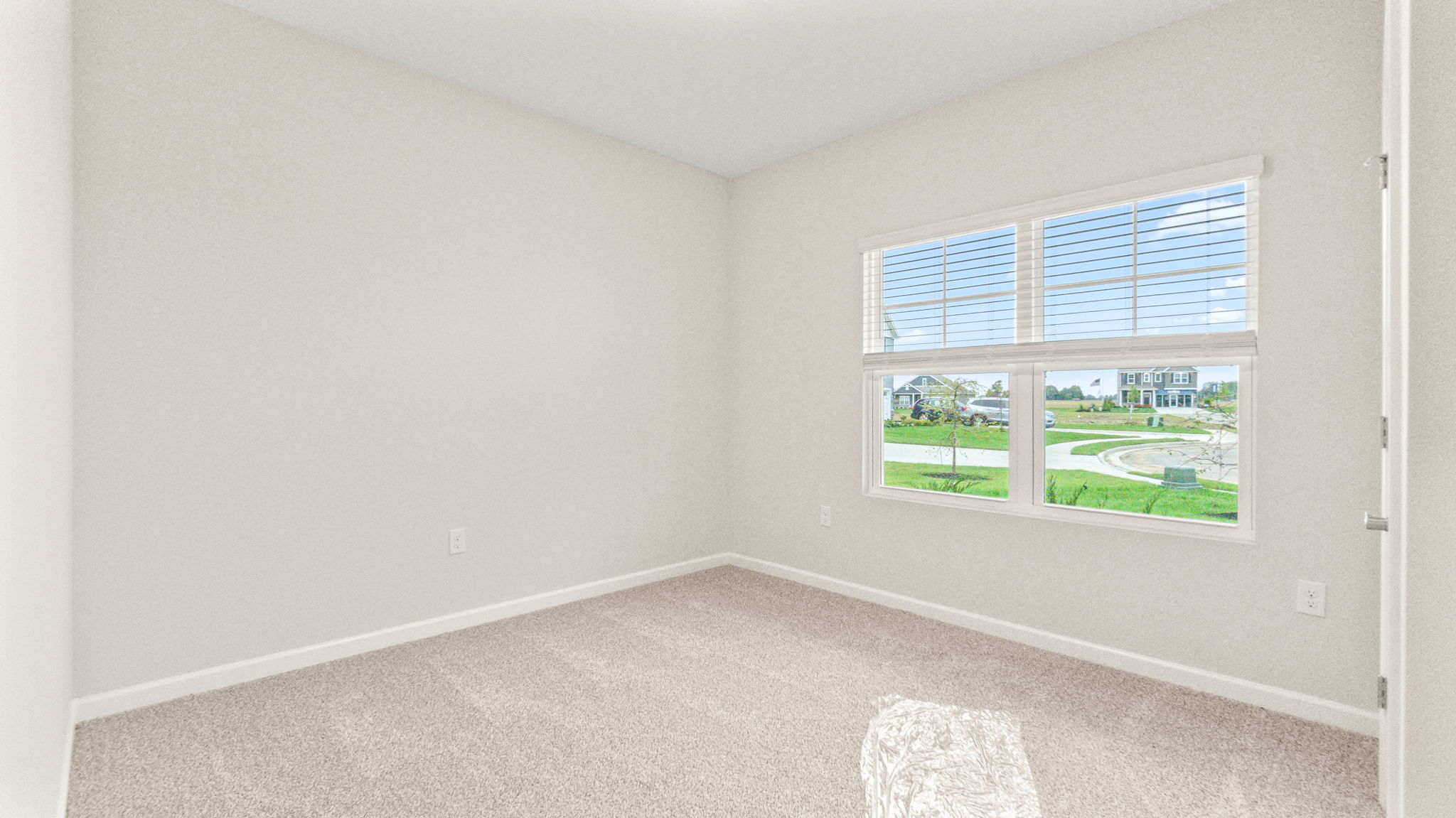 carpeted bedroom with winow
