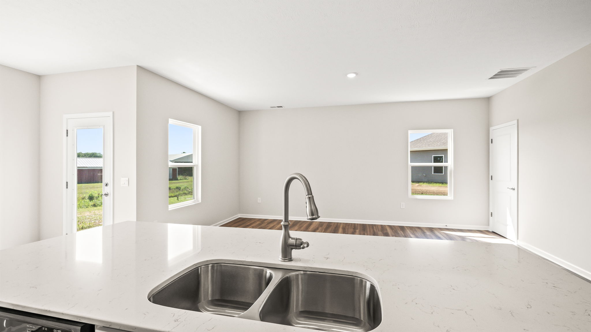 Point of view of great room from kitchen island