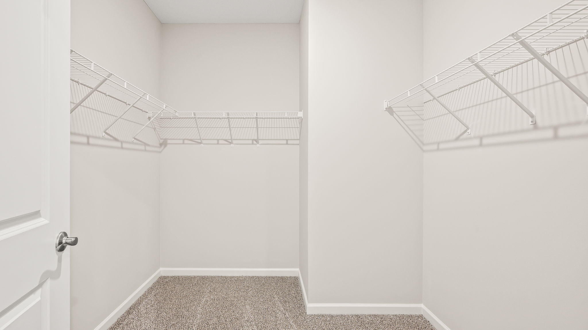 Walk-in closet with wire rack shelving