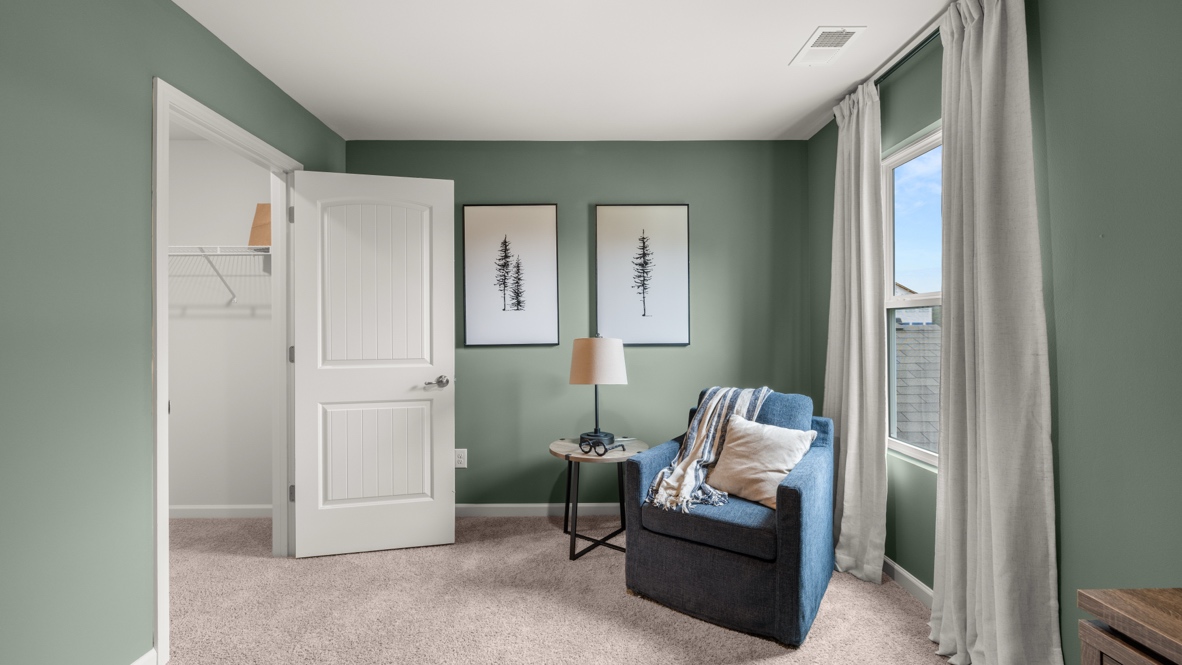 Single-seater next to nightstand and walk-in closet