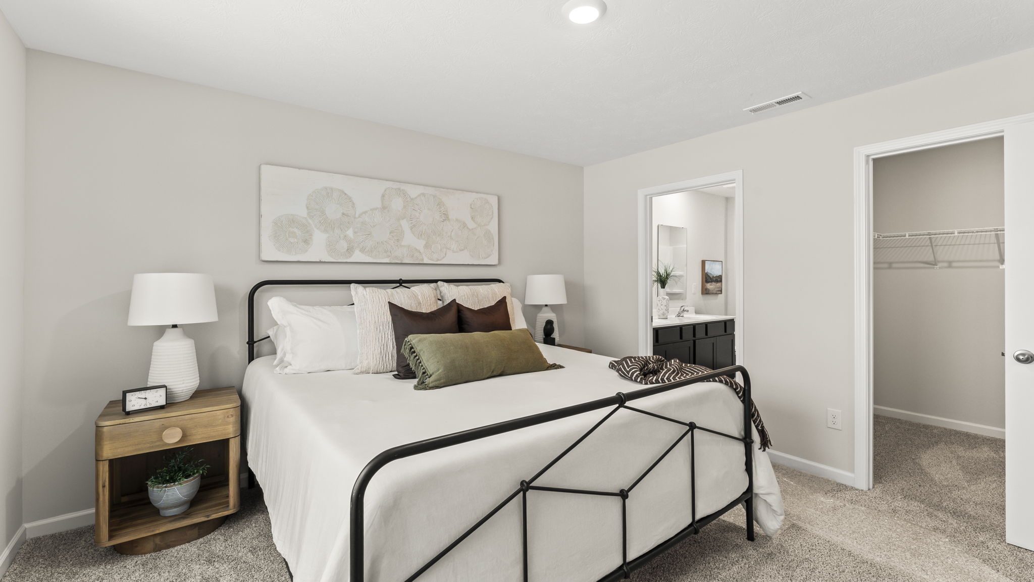 Primary bedroom designed with privacy and comfort, connecting to a spa-inspired ensuite bathroom and walk-in closet