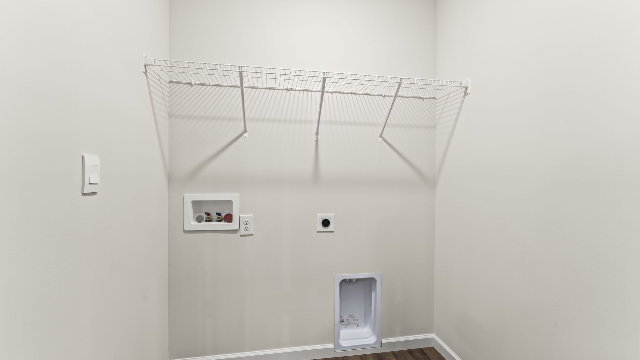Utility laundry room with shelf, washer-dryer included, Georgetown Village By D.R. Horton
