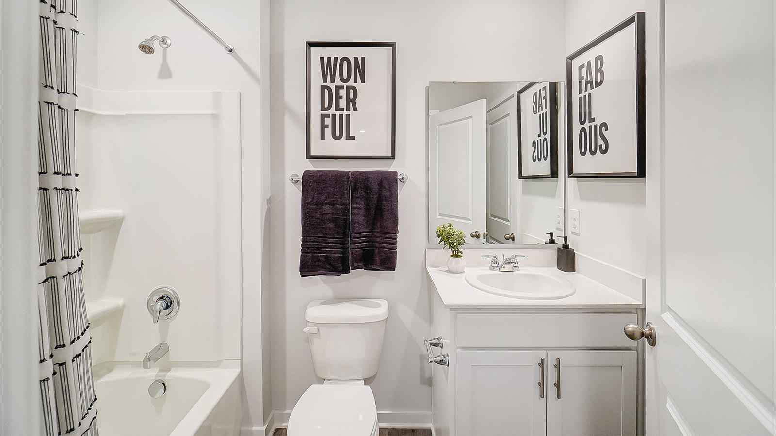 Full bathrom with all white décor.
