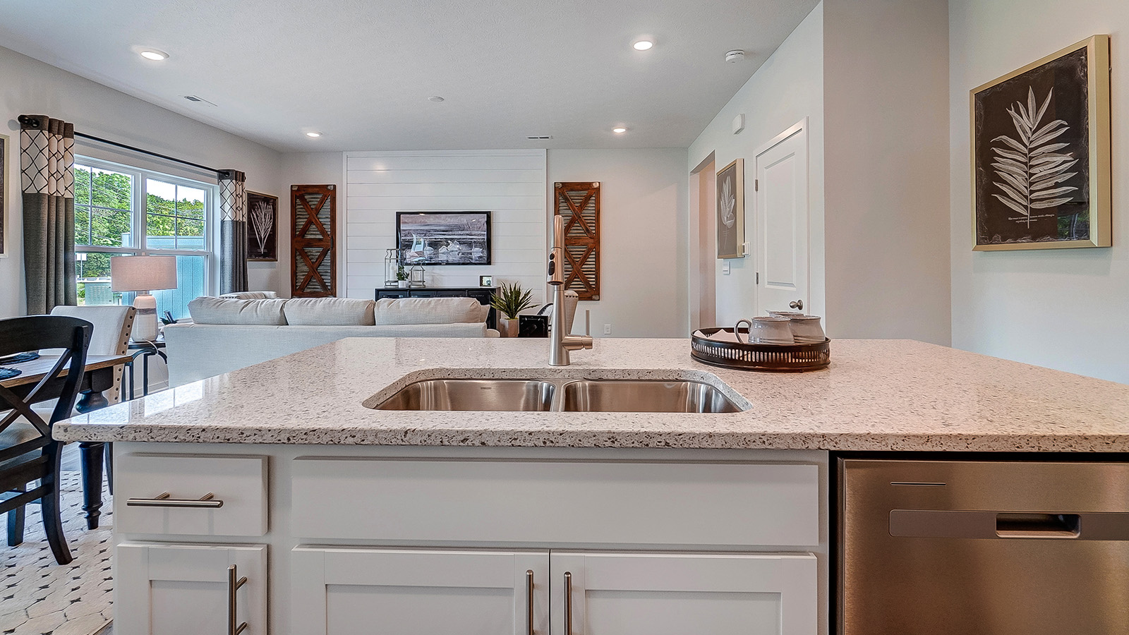 Kitchen sink with living room in the background.