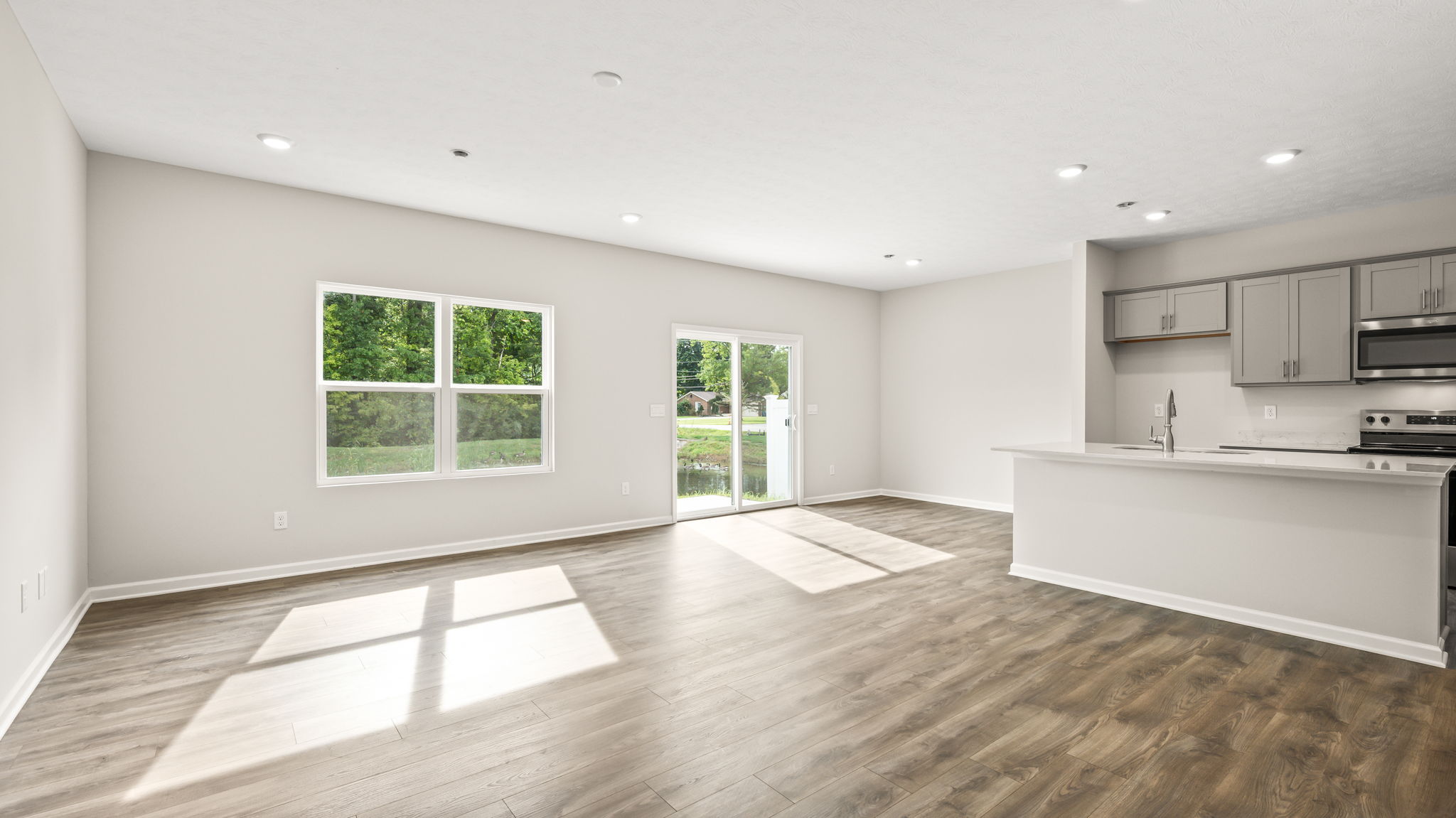 Great room with natural lighting as focus