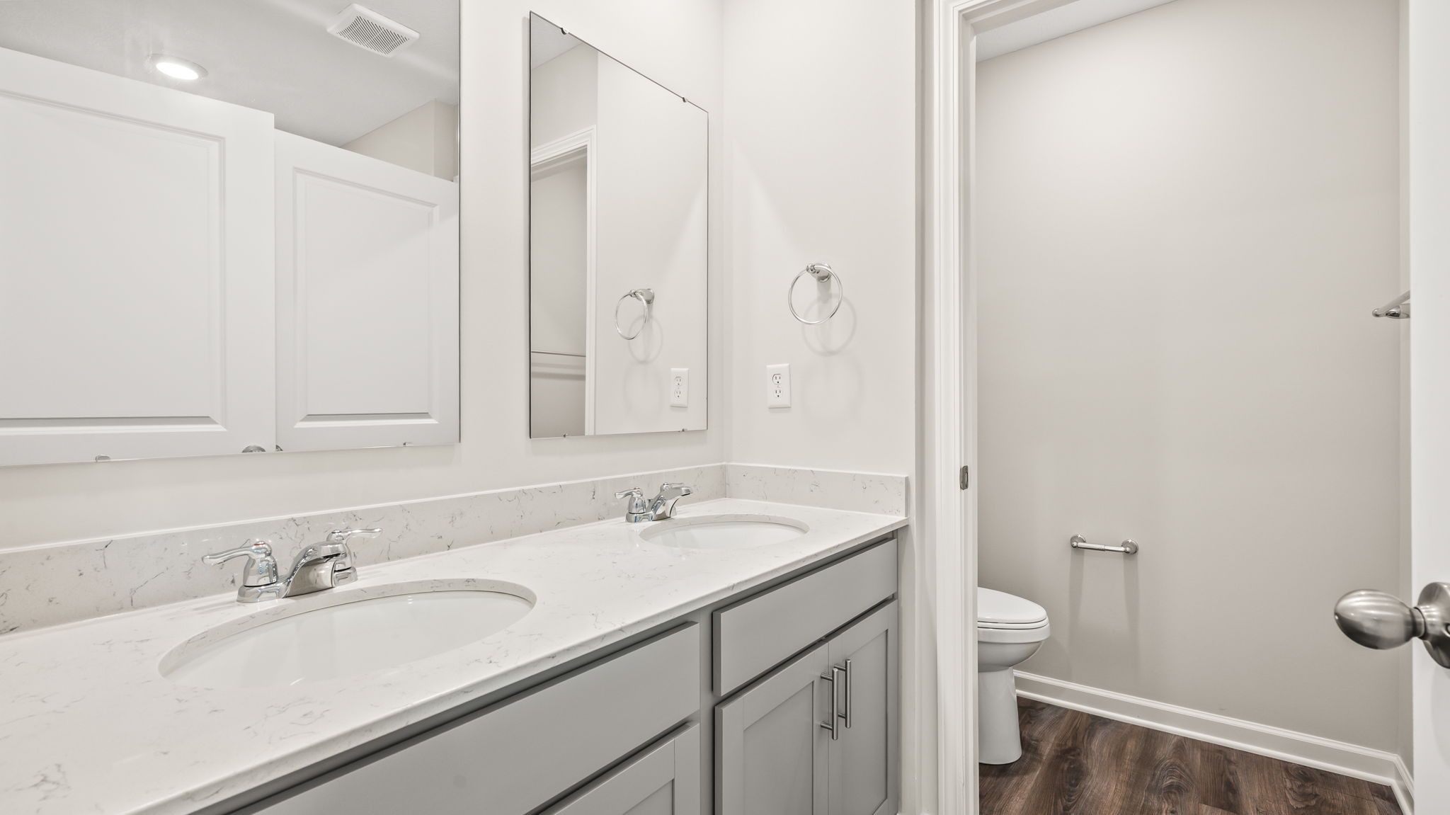 Closeup of dual vanity sink with mirrors