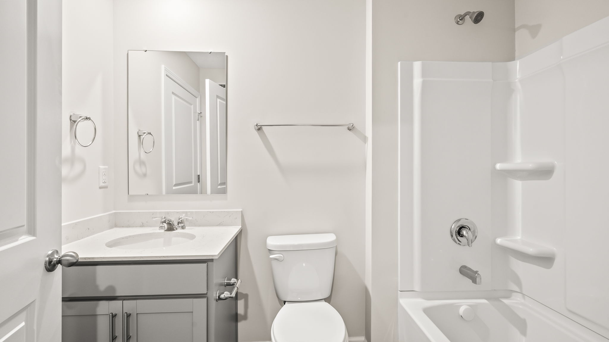 Bathroom with sink, toilet, and tub