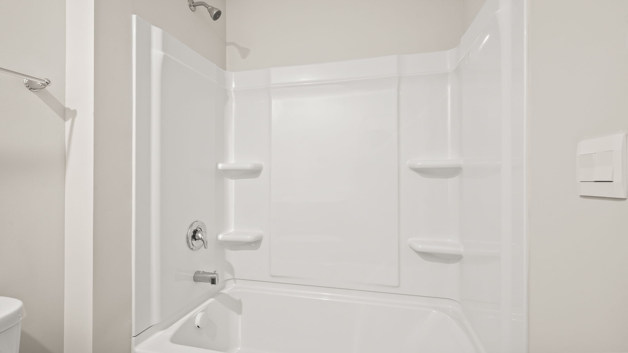Tub and shower with tiered shelving