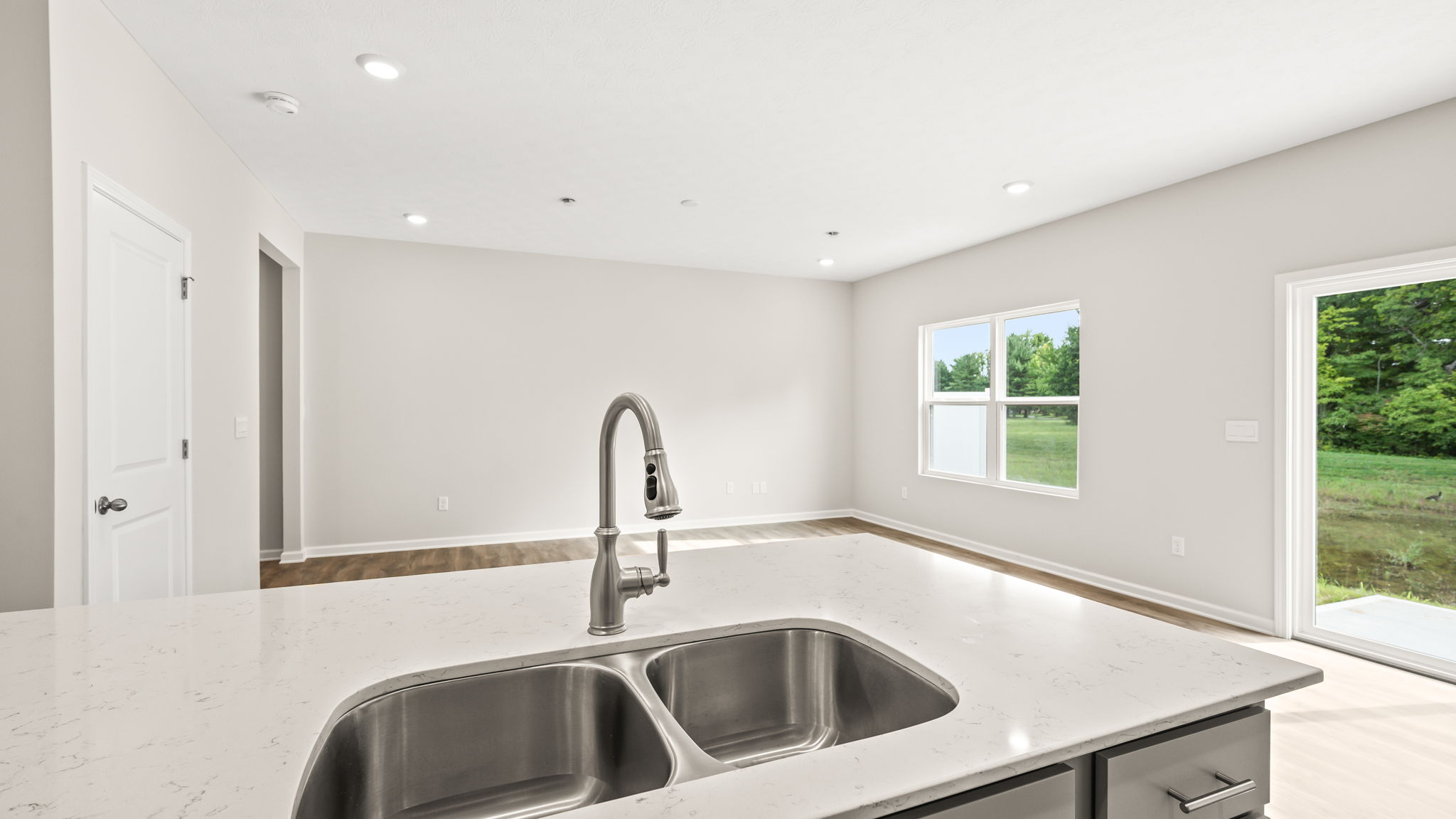 Perspective of kitchen island with sink