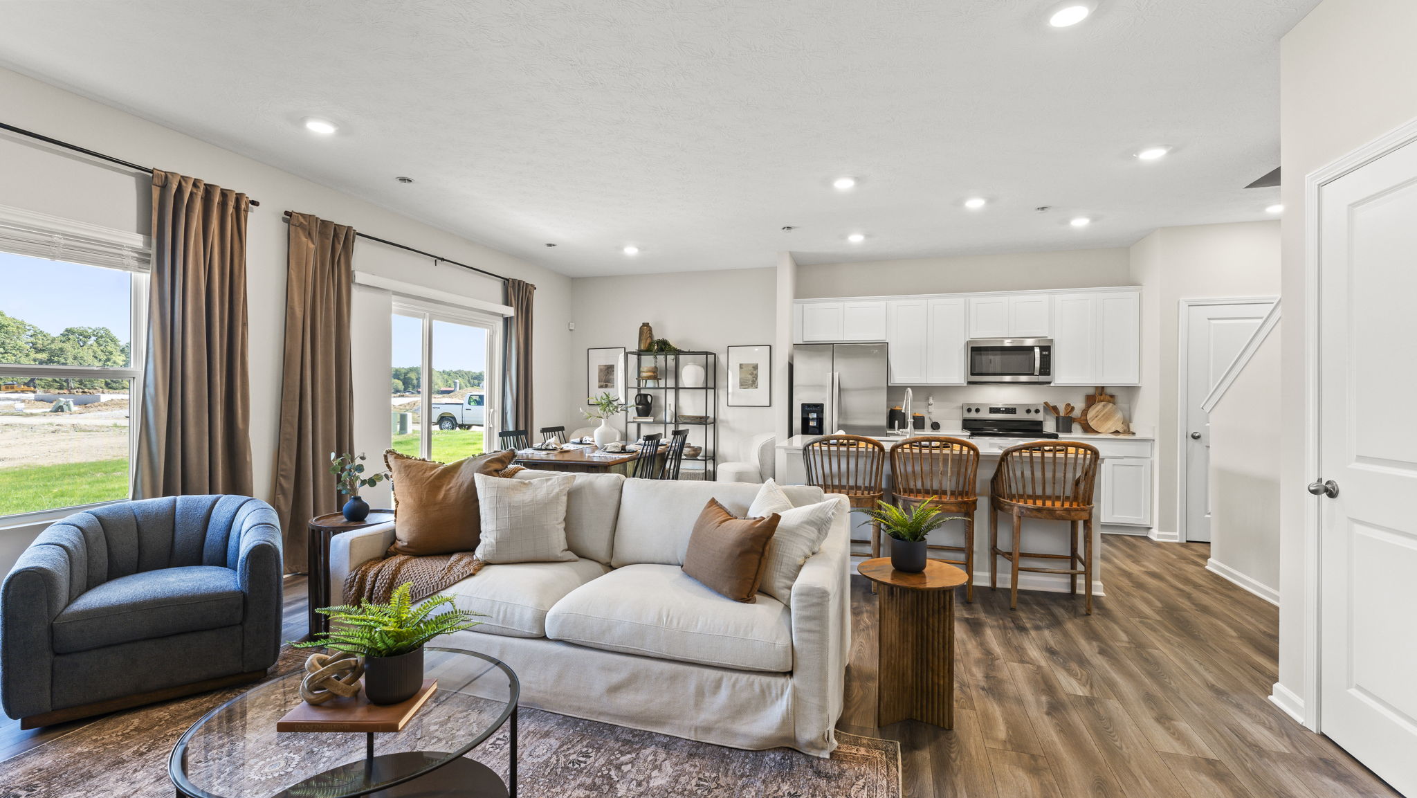 Living room furniture with view of kitchen