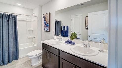 Full bathrom with all white décor.
