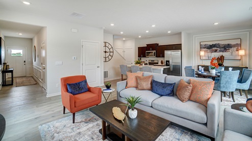 Living room in full with modern art and wooden décor.